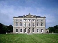 Castle Ward: In the midst of a beautiful 700 acre estate on the shores of Strangford Lough, seven miles east of Downpatrick, stands Castle Ward - an 18th century 'architectrual wonder.'Bernard Ward, 1st Viscount Bangor and his wife Anne could not agree, especially when it came to the architectural style of their home. A compromise was reached. Lady Anne got her way with the back of the 1760s house, which is in the Strawberry Hill Gothic style, while the front facade reflects here husband's neo-classic taste. This division of styles runs right through the house; the music room is in the severe classic style with Doric frieze and columns while the whimsical Gothic boudoir has spectacular fan vaulting. Interior decoration is a known cause of marital disharmony and Lady Anne eventually left her husband for good. The house is surrounded by woods, farmland, landscaped gardens and lakes, including the Temple Water which is overlooked by a pedimented temple. An underground passage links the house to the stableyard, a hub of activity for visitors to the estate.CLICK FOR LARGER PICTURE
